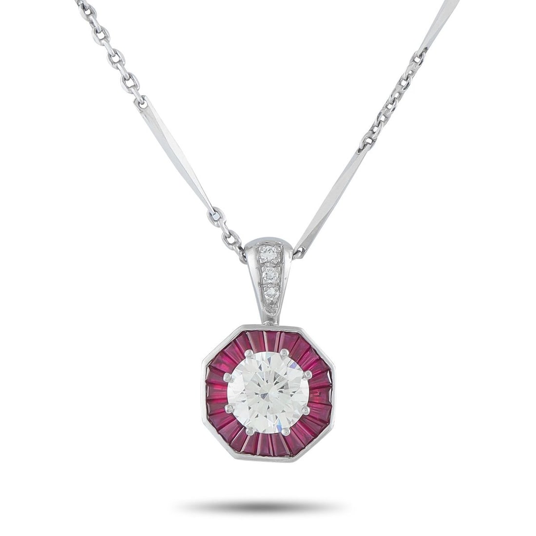 PLATINUM 2.21CT DIAMOND AND RUBY PENDANT NECKLACE: This necklace is undeniably chic. A 2.21 carat Diamond with K color and SI1 clarity sparkles at the center of this pieces pendant. Vibrant Ruby gemstones with a total weight of 1.90 carats surround th