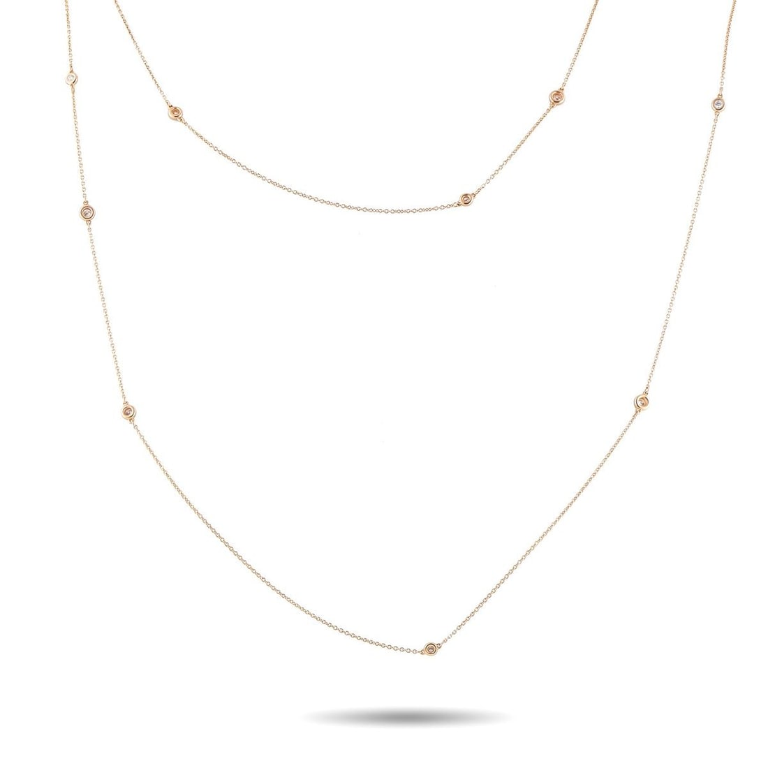TIFFANY & CO. DIAMONDS BY THE YARD 18K ROSE GOLD 2.50CT DIAMOND NECKLACE: Add a touch of sophistication to any ensemble with this simple, elegant Tiffany & Co. Diamonds by the Yard necklace. This piece is crafted from 18K Rose Gold and features a series of bezel-set Diamond