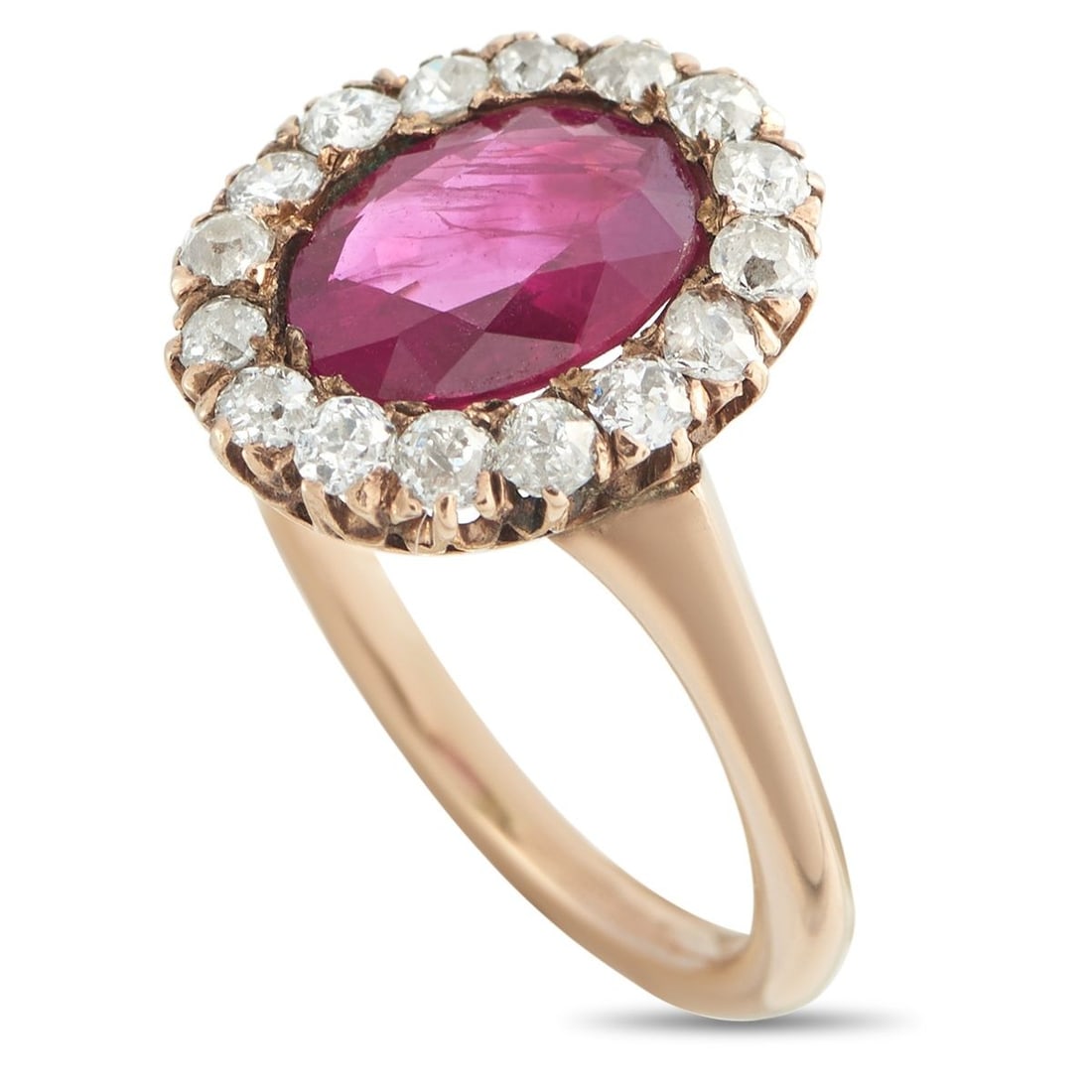 ANTIQUE 18K ROSE GOLD 0.30CT DIAMOND AND RUBY RING: This antique ring is teeming with old fashioned elegance. A 1.0 carat Ruby makes a statement at the center, while a halo of sparkling Diamonds totaling 0.30 carats allow it to effortlessly catch the l