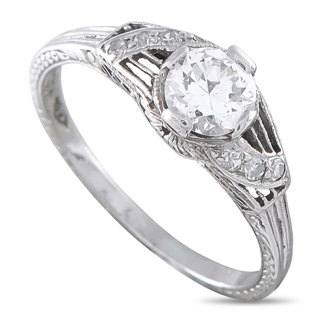 ANTIQUE PLATINUM 0.55CT DIAMOND ENGAGEMENT RING: This antique engagement ring is an ideal piece for anyone who appreciates timeless luxury. The Platinum setting is filled with unique details that come together to create a stunning, sophisticated des