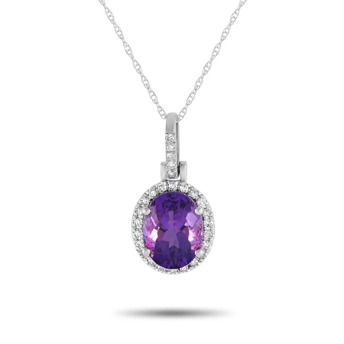 14K WHITE GOLD 0.13CT DIAMOND AND AMETHYST PENDANT NECKLACE: Add elegance to any ensemble with this impeccably crafted necklace. Crafted from 14K White Gold, this piece features a stunning Amethyst center stone and Diamond accents with a total weight of 0.13 ca