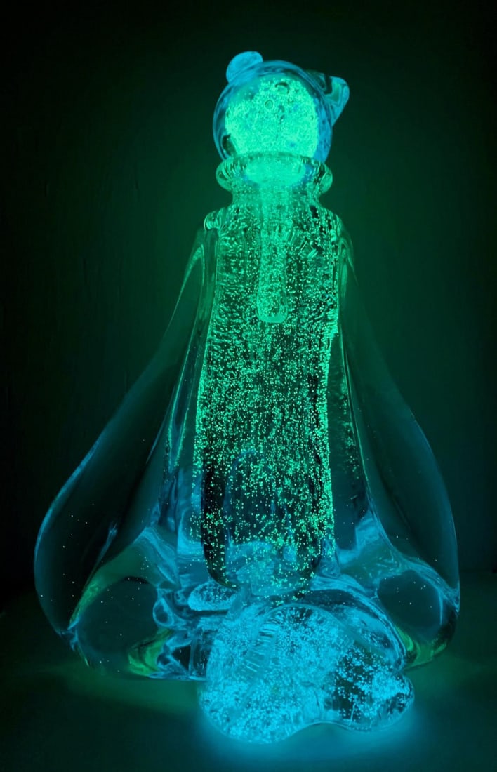 Jean Claude Novaro- Hand blown glass sculpture: Artist: Jean Claude Novaro. Medium: Hand blown glass sculpture. Size: 9" x 13". Signature: Hand Signed by the artist. Additional: Glows in the dark . Reference#: 61372.