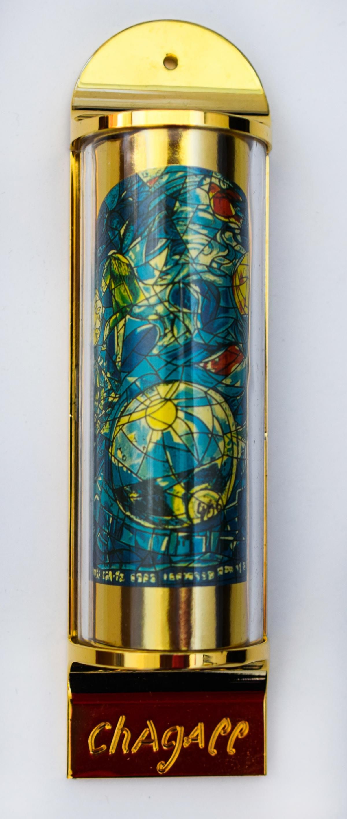 Marc Chagall- Mezuzah - silkscreen on 24K gold plated bronze "12 Tribes Hadassah Windows - Simeon": Artist: Marc Chagall. Medium: Mezuzah - silkscreen on 24K gold plated bronze. Title: 12 Tribes Hadassah Windows - Simeon. Size: 5" x 1.5". Certificate of Authenticity: Is included. Additional: Limited