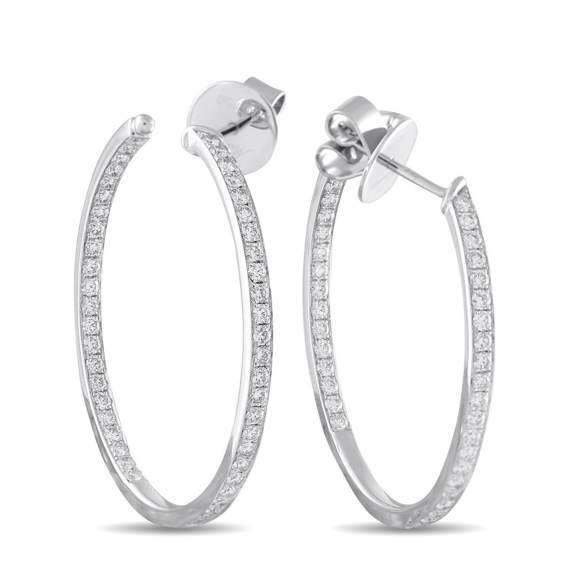 MEMOIRE 18K WHITE GOLD 1.50CT DIAMOND INSIDE-OUT HOOP EARRINGS: These Memoire hoop earrings are simple and incredibly elegant. Diamonds with a total weight of 1.50 carats add a touch of luxury to the understated design. Set in 18K White Gold, each one measures