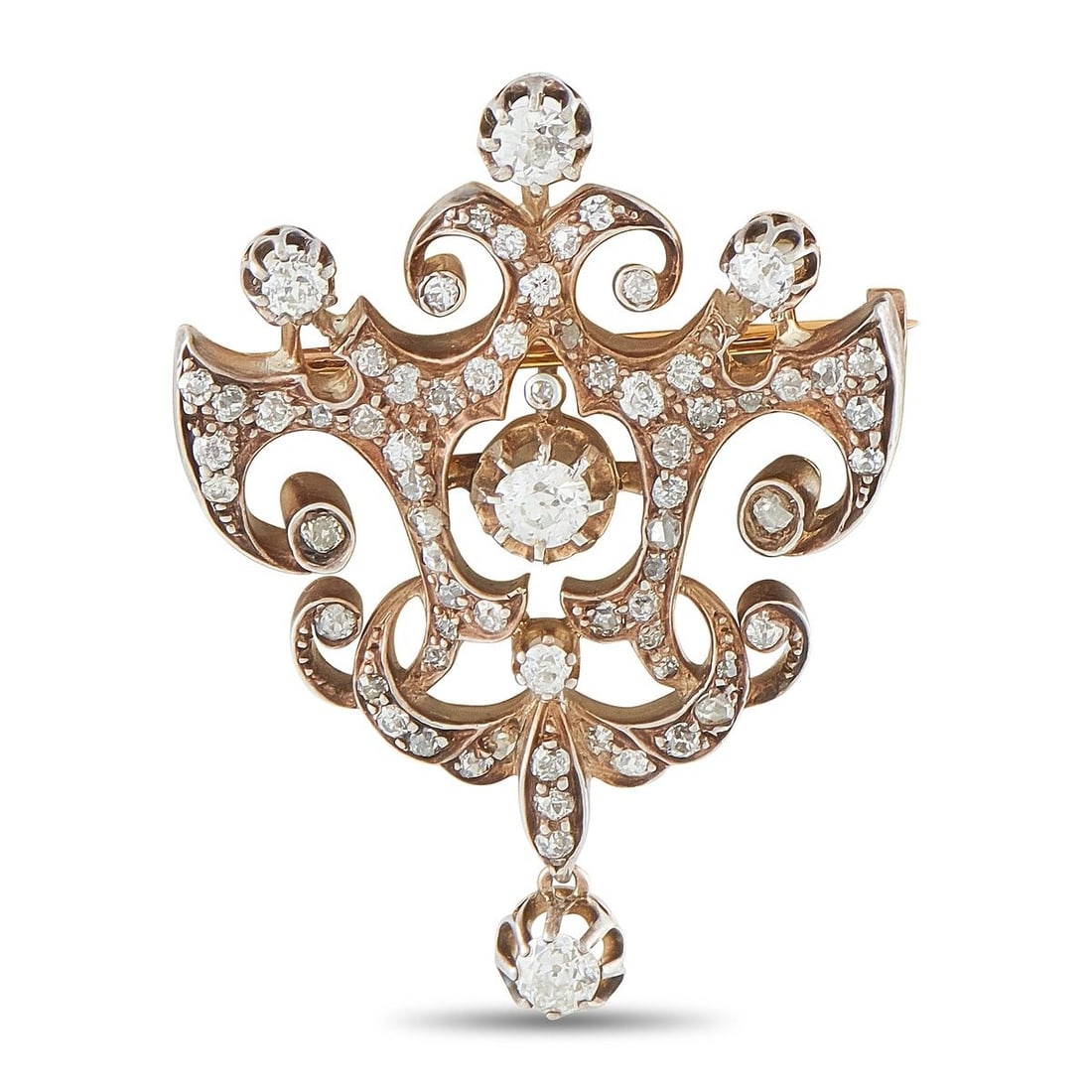 ANTIQUE 18K ROSE GOLD AND SILVER 1.85CT DIAMOND BROOCH: This brooch is an antique French design crafted in 18K rose gold with silver-topped settings, showcasing an intricate scrolling framework set throughout with old mine cut diamonds totaling approximate