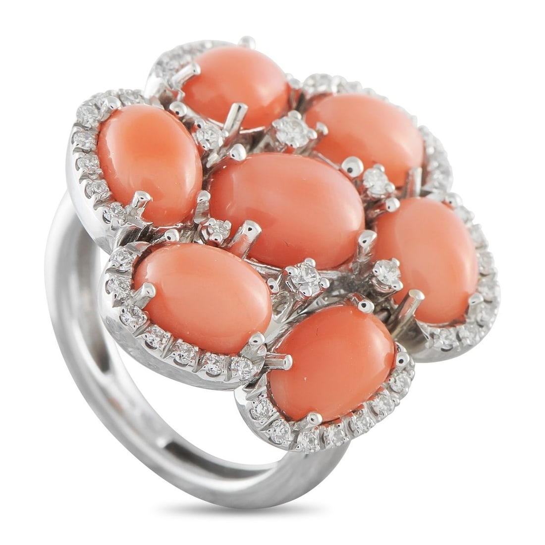 ZYDO 18K WHITE GOLD 0.50CT DIAMOND AND CORAL RING: This Zydo ring is simply breathtaking. Coral cabochons with a total weight of 7.32 carats decorate the top of this pieces 18K White Gold setting. Diamond accents totaling 0.50 carats add color, sparkl