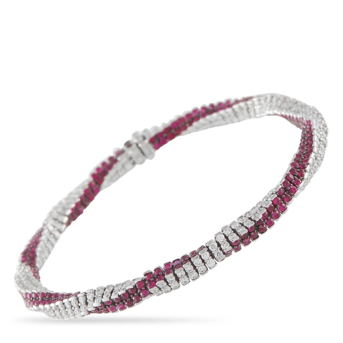 ASSAEL 18K WHITE GOLD 5.48CT DIAMOND AND RUBY SNAKE BRACELET: This Assael bracelet is crafted in 18K white gold in a flexible snake-link design, set with round brilliant-cut diamonds totaling approximately 5.48 carats alongside vivid red rubies totaling approxim