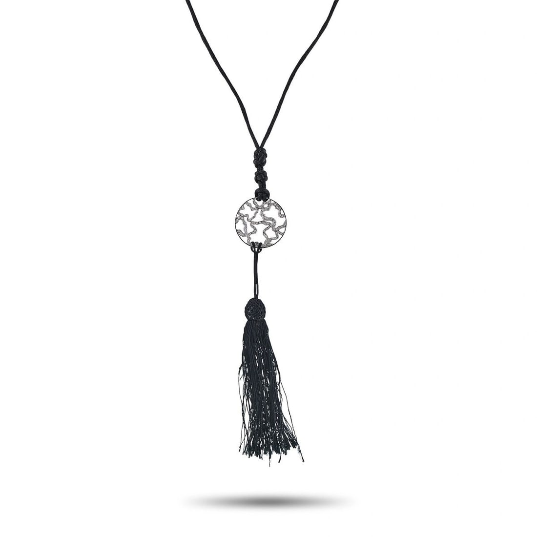 TOUS 18K WHITE GOLD 0.25CT DIAMOND OPENWORK TASSEL NECKLACE: A striking tassel necklace in 18K white gold, featuring a circular openwork disc pendant pav-set with approximately 0.25 carats of round brilliant diamonds in an organic, flowing motif. The disc suspe