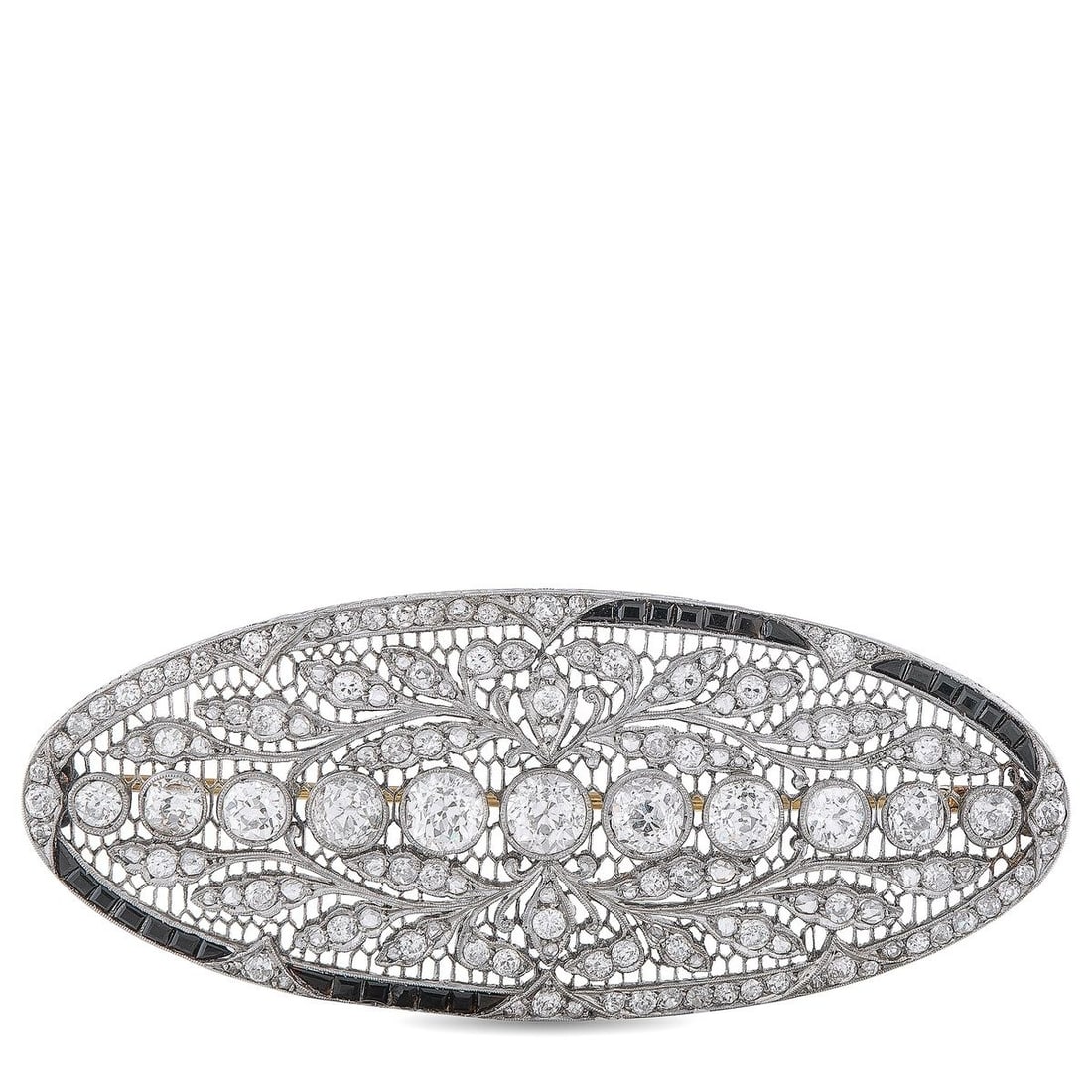 PLATINUM 7.85CT DIAMOND AND SAPPHIRE BROOCH: This intricate Platinum brooch is teeming with old fashioned elegance. Ideal for anyone who loves bold, opulent accessories, this pieces intricate metalwork is highlighted by sparkling Diamonds with a