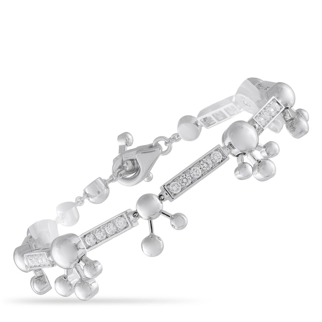 BVLGARI ASTRALE 18K WHITE GOLD 1.45CT DIAMOND BRACELET: With motifs that evoke constellations, this Bvlgari Astrale bracelet is a wearable work of art. This sleek, sophisticated design includes sparkling Diamonds with a total weight of 1.45 carats, which e