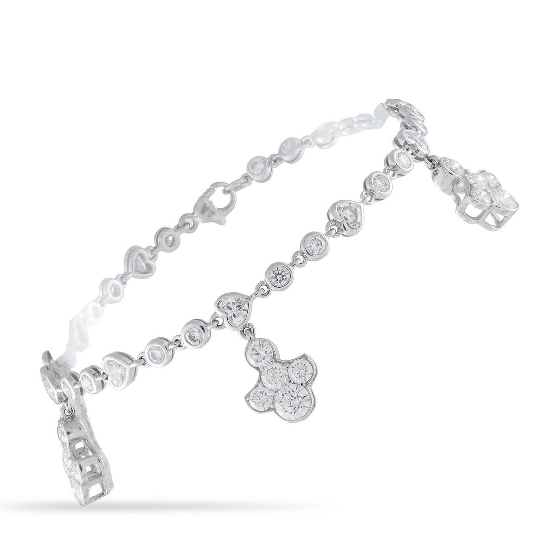 GRAFF 18K WHITE GOLD 6.70CT DIAMOND BRACELET: This Graff bracelet will effortlessly catch the light. Crafted from 18K White Gold, Diamonds with a total weight of 6.70 carats adorn the chain and dangling charms. It measures 7.0 long and will add p