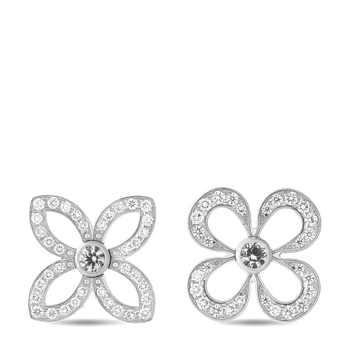 LOUIS VUITTON 18K WHITE GOLD DIAMOND MONOGRAM FLOWER EARRINGS: A mismatched design makes these Louis Vuitton earrings even more charming. Set in 18K White Gold, they feature two of the brands iconic monogram flower motifs. Sparkling Diamonds add even more luxury 