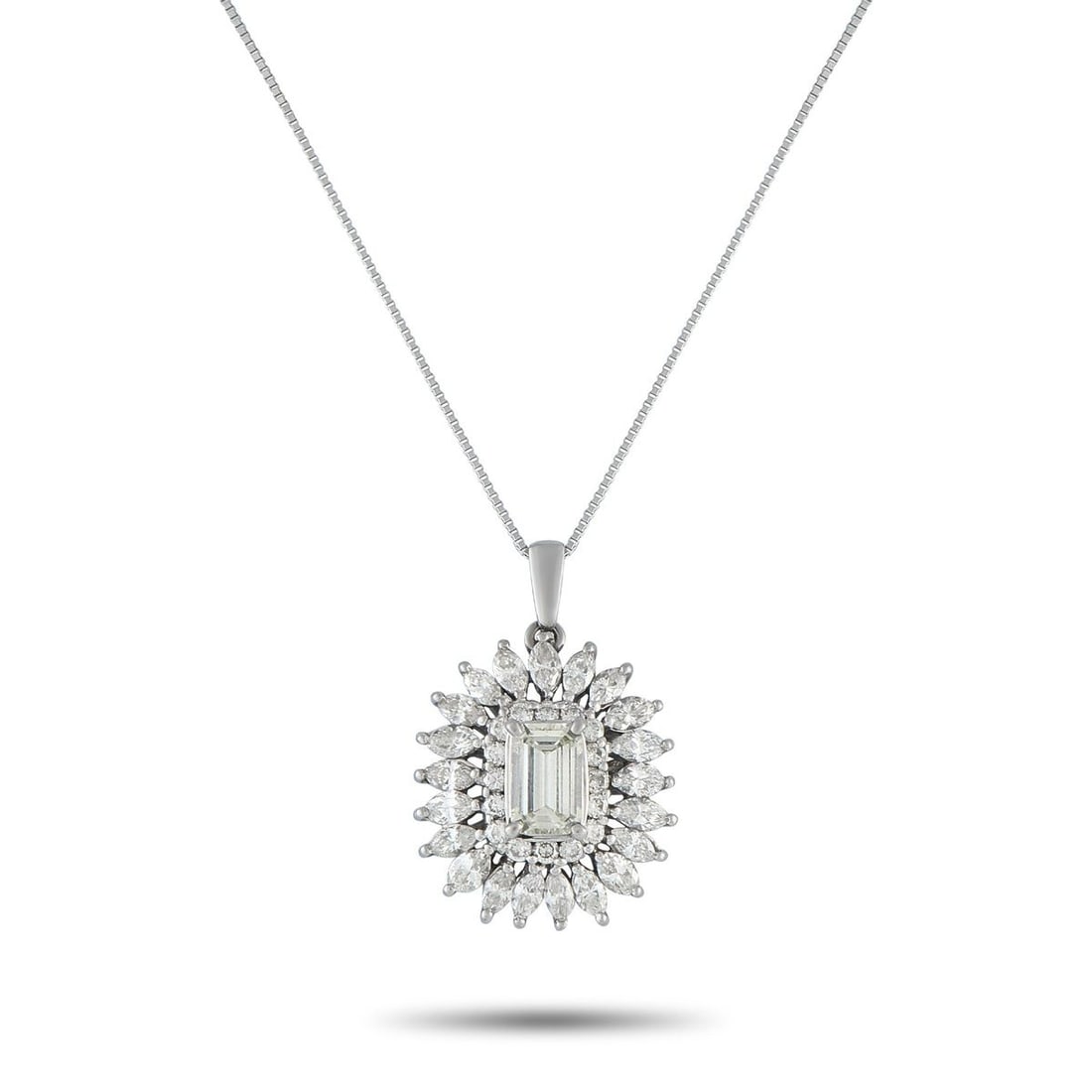 PLATINUM 3.12CT DIAMOND PENDANT NECKLACE: This luxurious necklace is designed to effortlessly catch the light. Set in Platinum, this pieces pendant features a 1.05 carat Diamond center stone and a halo of additional Diamonds totaling 2.07 car