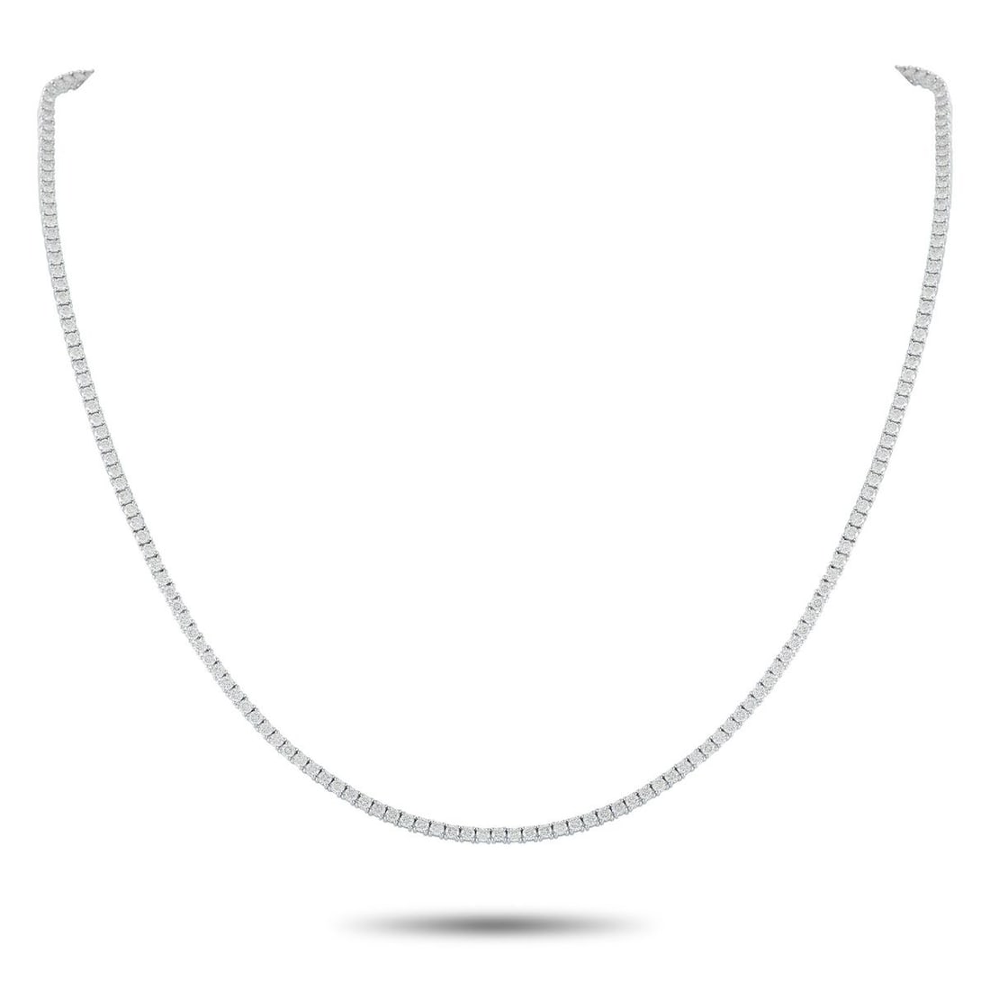 18K WHITE GOLD 5.92CT DIAMOND TENNIS NECKLACE: Add a subtle touch of luxury to any ensemble with this classic tennis necklace. The elegant, understated design shines to life thanks to a series of Diamonds totaling 5.92 carats. Set in 18K White Gol