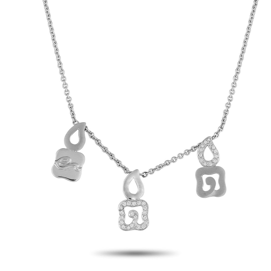 LA NOUVELLE BAGUE 18K WHITE GOLD 0.33CT DIAMOND CHARM NECKLACE: Like all La Nouvelle Bague accessories, this necklace blends traditional design techniques with an evocative, contemporary sense of style. Suspended from a delicate 17.5 chain, a trio of small pendant