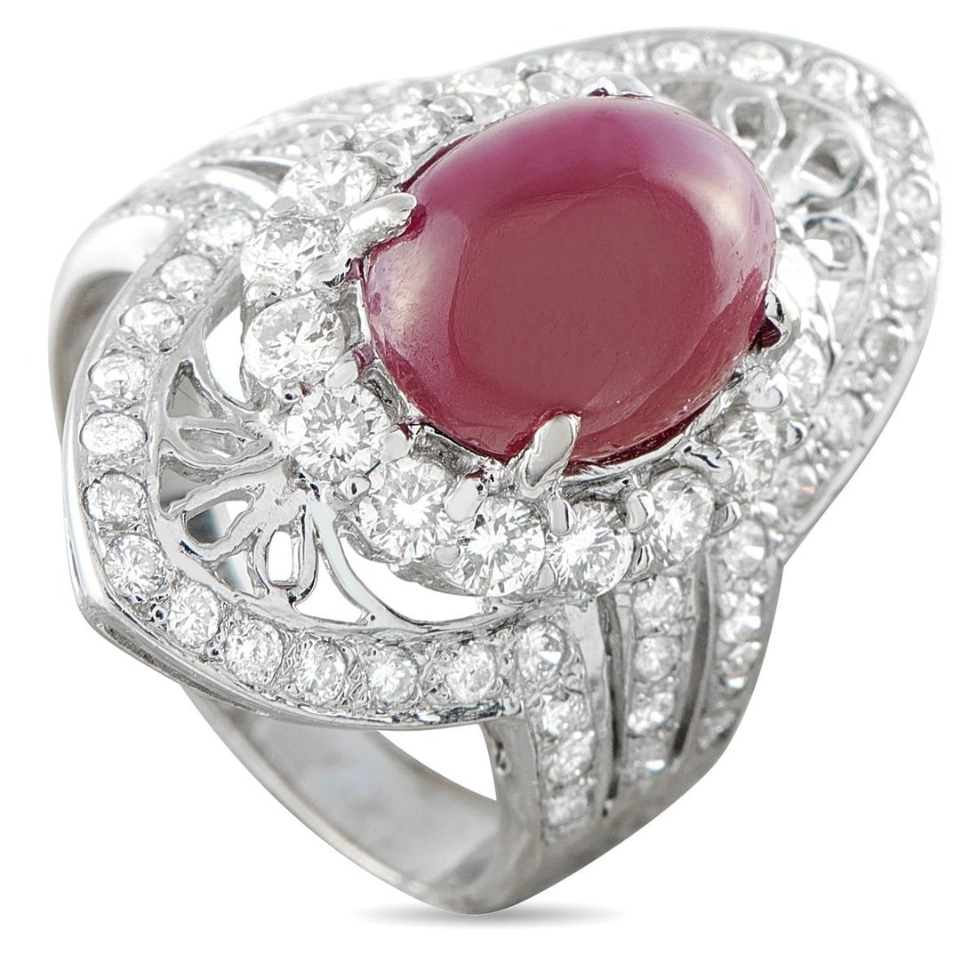 18K WHITE GOLD 1.10CT DIAMOND AND RUBY COCKTAIL RING: A spectacular cocktail ring in 18K white gold, centering a deep crimson oval ruby cabochon of approximately 4.25 carats within an ornate openwork marquise-shaped mounting pav-set with round brilliant 