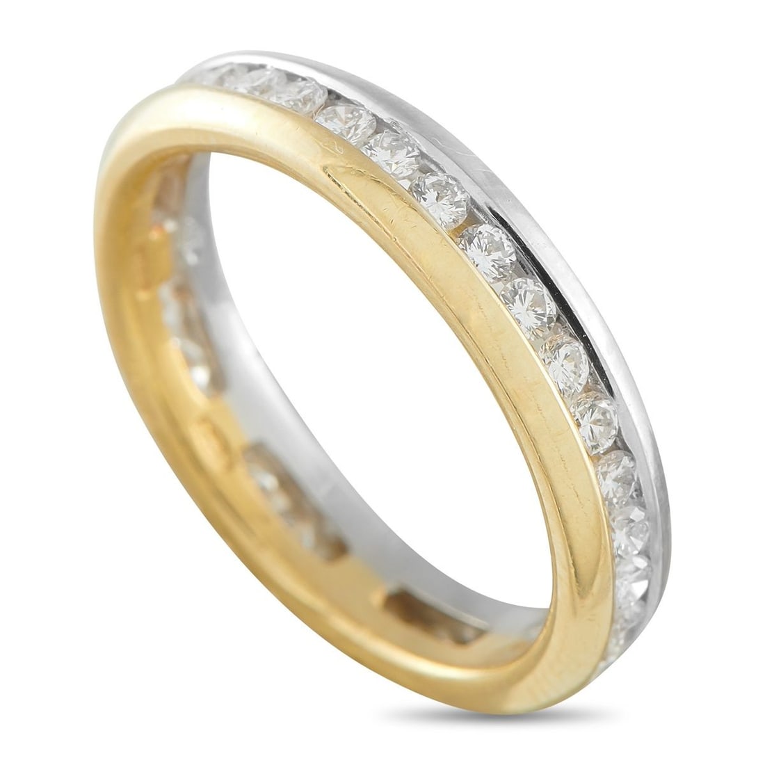 18K YELLOW AND WHITE GOLD 1.08CT DIAMOND ETERNITY RING: A lasting symbol of unity and continuity. This piece pairs channel-set round diamonds with a two-toned frame, blending white gold along one edge and yellow gold along the other. The diamonds run conti