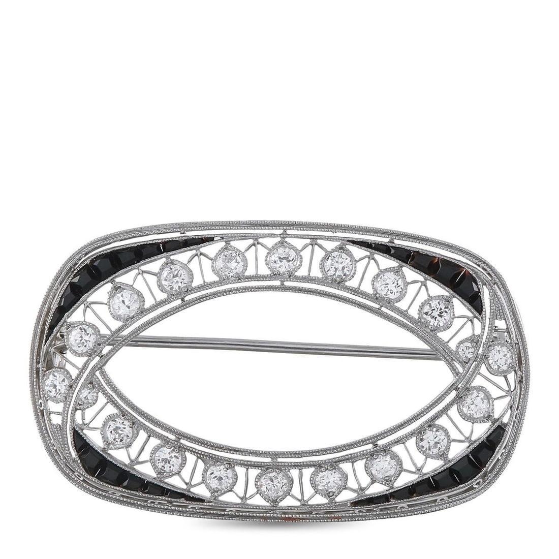 PLATINUM 0.80CT DIAMOND AND SAPPHIRE BROOCH: A detailed Platinum setting makes this luxury brooch simply unforgettable. Round-cut Diamonds with a total weight of 0.80ct carats are highlighted by this pieces breathtaking negative space details. S