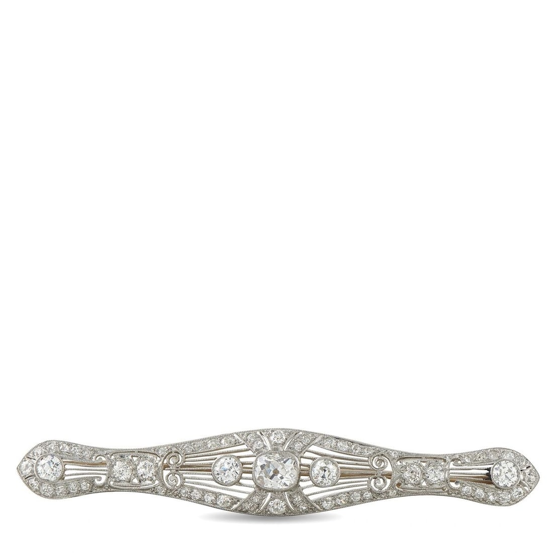 PLATINUM AND 18K WHITE GOLD 2.60CT DIAMOND ART DECO BROOCH: This Art Deco brooch is crafted in platinum and 18K white gold in an elongated, gently curved bar silhouette, pierced with fine filigree and set throughout totaling approximately 2.6 carats, anchored 