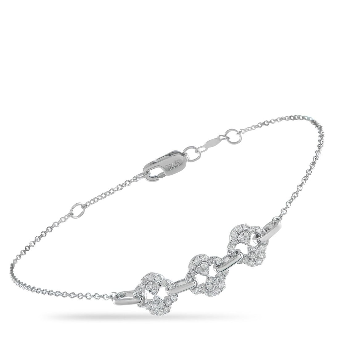 14K WHITE GOLD 0.40CT DIAMOND BRACELET: This elegant, understated bracelet is ideal for everyday wear. An arrangement of Diamonds totaling 0.40 carats sits at the center of this pieces delicate 7 chain. Crafted from 14K White Gold, it comes