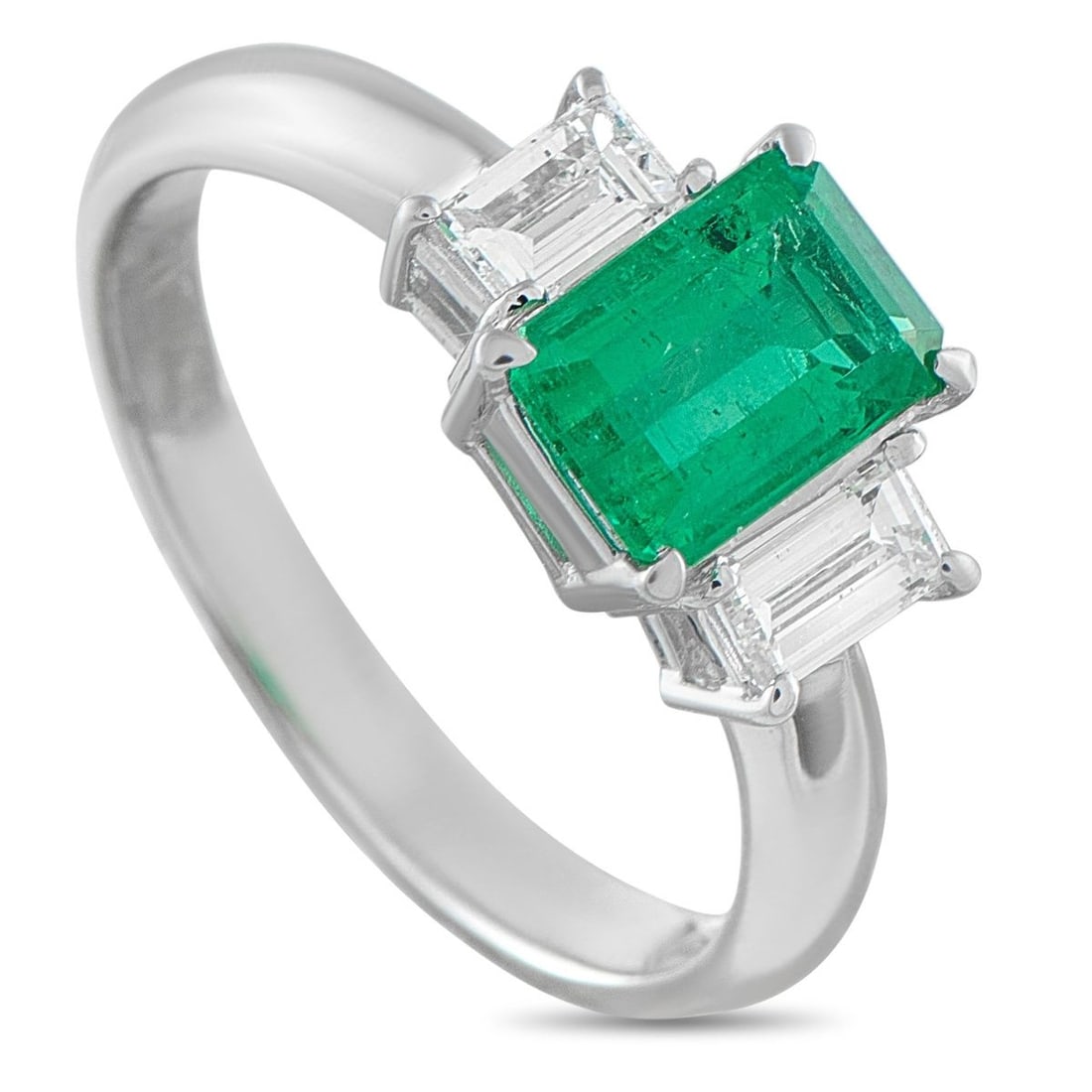 PLATINUM 0.51CT DIAMOND AND EMERALD THREE-STONE RING: This three-stone ring carries the profound symbolism of a relationship's past, present, and future. At its heart is a 1.15-carat emerald, its rich color flanked by two emerald-cut diamond side