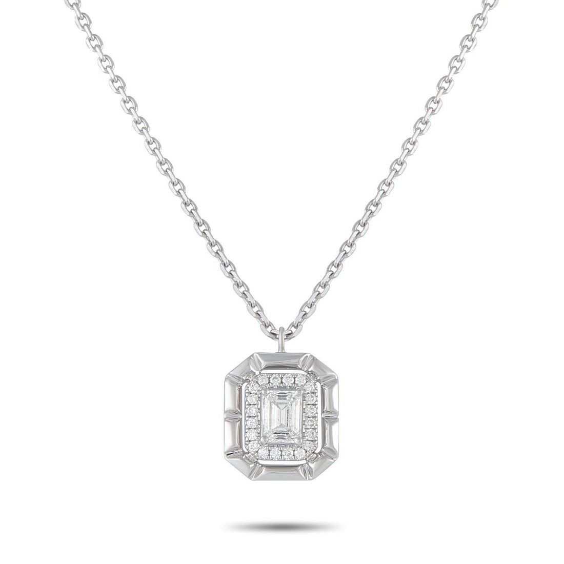 18K WHITE GOLD 0.62CT DIAMOND PENDANT NECKLACE: A 0.50 carat Diamond makes a statement at the center of this exquisite necklace. Set in 18K White Gold, additional Diamond accents totaling 0.12 carats surround the center stone for additional sparkle