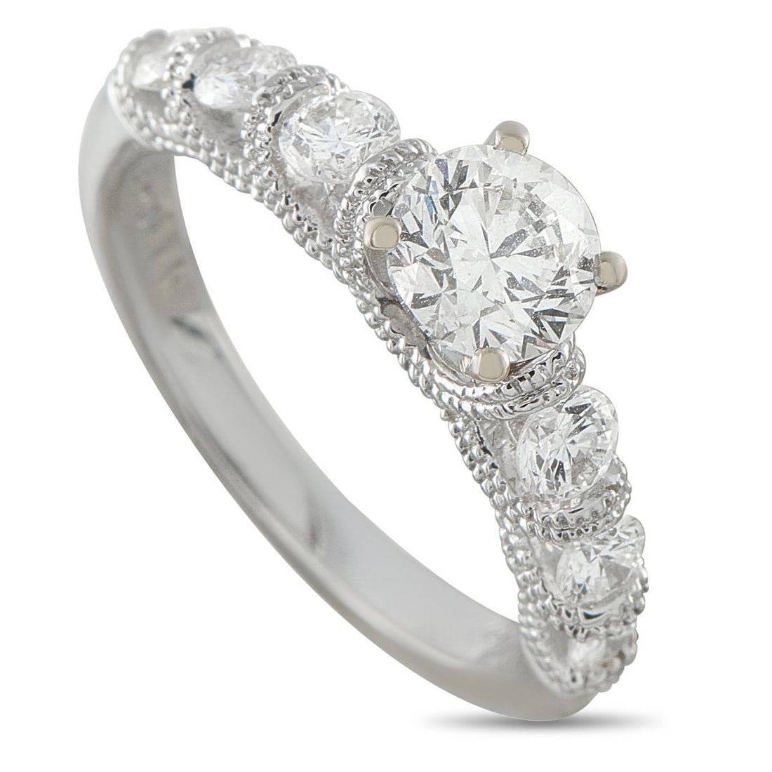 18K WHITE GOLD 1.17CT DIAMOND RING: This luxury ring is filled with intricate details. The 18K White Gold setting features millegrain details for added texture and dimension. At the center, Diamonds with a total weight of 1.17 carats ma
