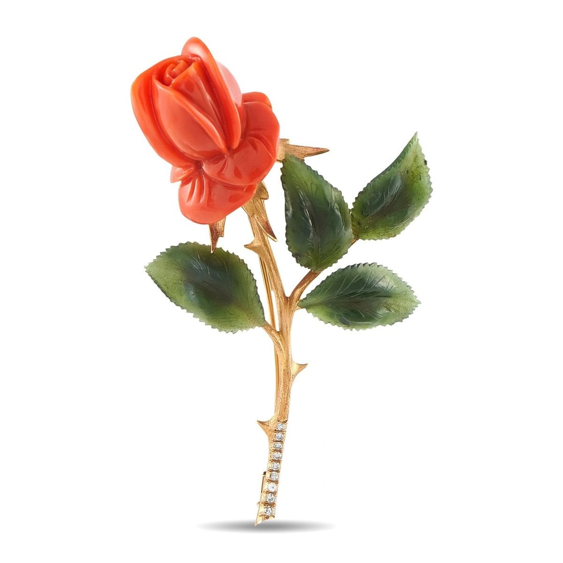 14K ROSE GOLD DIAMOND, CORAL, AND JADE FLOWER BROOCH: This vintage-style brooch is crafted in 14K rose gold in the form of a blooming rose, featuring a hand-carved coral bud and carved nephrite jade leaves, accented with pave diamonds along the thorny st