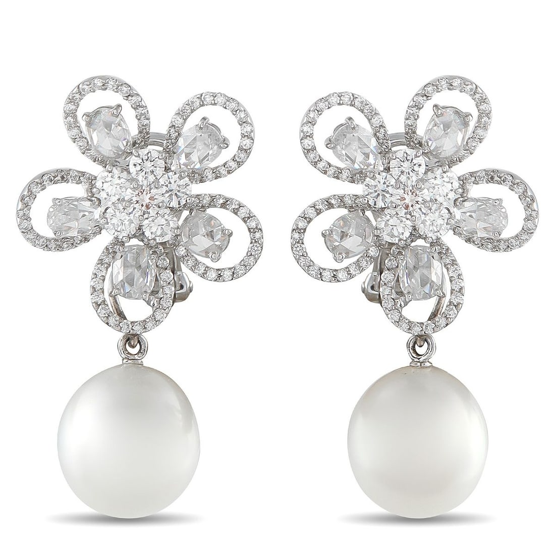 ASSAEL 18K WHITE GOLD 5.24CT DIAMOND AND PEARL CLIP-ON EARRINGS: Diamonds with a total weight of 5.24 carats make these Assael earrings instantly captivating. Crafted from 18K White Gold, luminous 14.3mm pearl accents dangle below the delicate flower-shaped setting