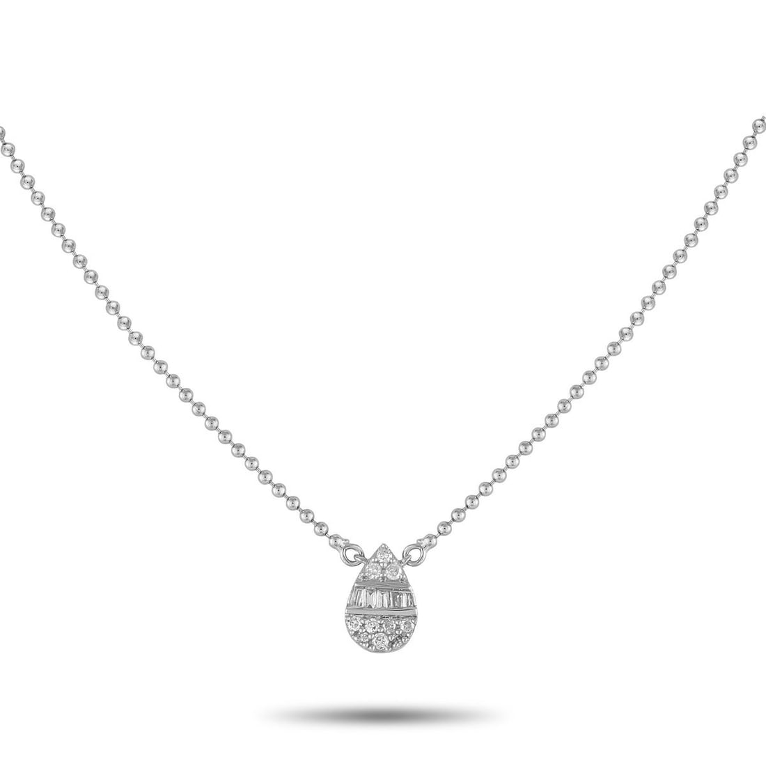 14K WHITE GOLD 0.11CT DIAMOND NECKLACE: You'll find yourself reaching for this necklace daily. Crafted for comfort and versatility, it features a fine and lightweight ball chain holding a pear-shaped cluster pendant of round and baguette di