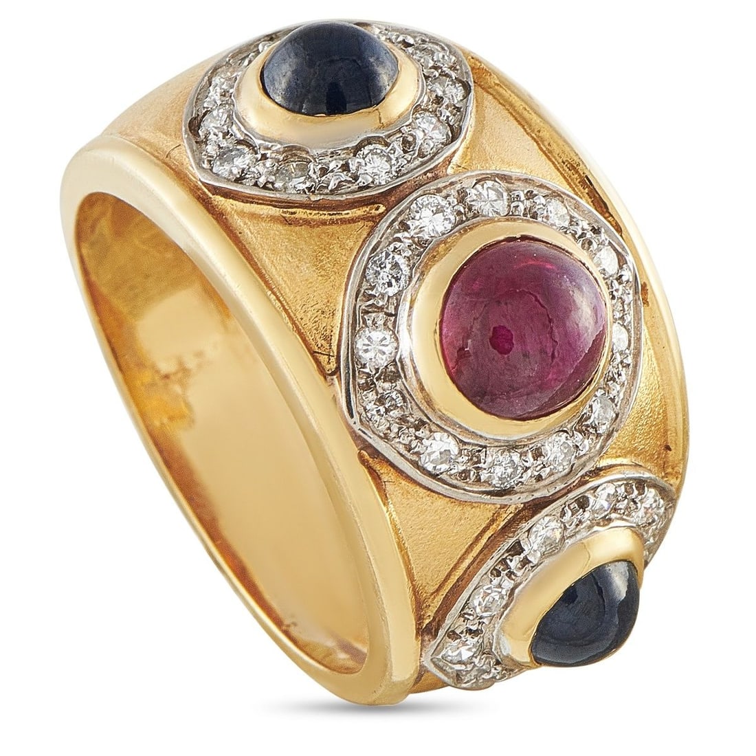 14K YELLOW GOLD 0.32CT DIAMOND, RUBY, AND SAPPHIRE RING: Bold and architectural, this estate ring features three cabochon-cut gemstonesa central round ruby and two blue sapphire cabochonseach bezel-set within their own diamond pave halo on a wide, polished 