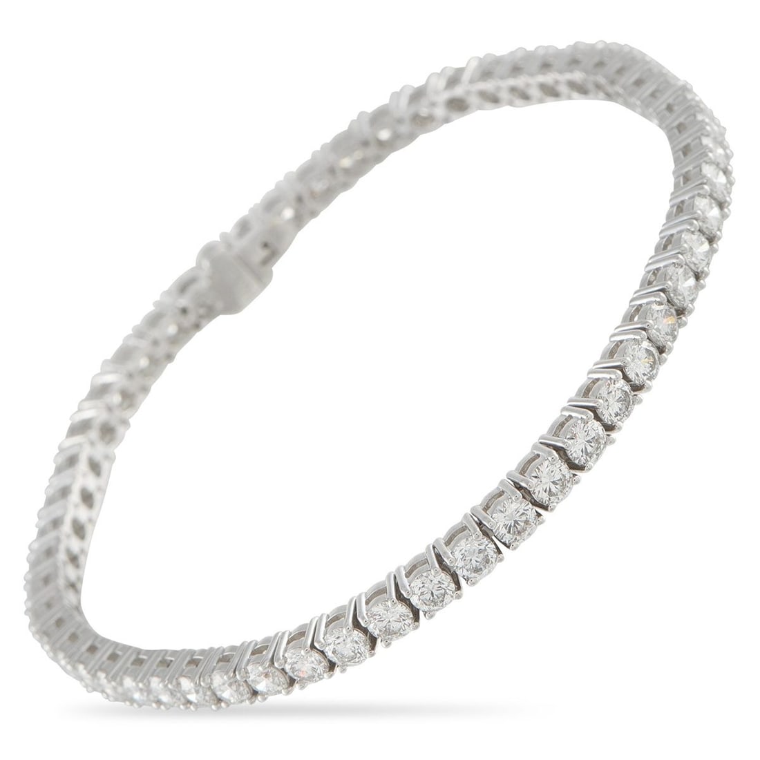 18K WHITE GOLD 6.91CT DIAMOND TENNIS BRACELET: A classically elegant design makes this tennis bracelet an essential addition to any jewelry collection. Set in 18K White Gold, Diamonds with a total weight of 6.91 carats provide endless sparkle. It 