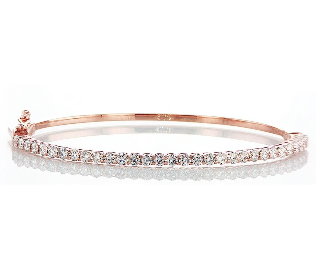 14kt Rose Gold 1.9ctw Diamond Bracelet: One 14k rose gold bracelet, set with lab grown diamonds. Jewelry Weight: 9.24Grs Total Diamonds Weight: 1.9Cts Main Stones Description: Quantity: 32 Cut and shape: Round Brilliant Carats Weight: 1.9 C