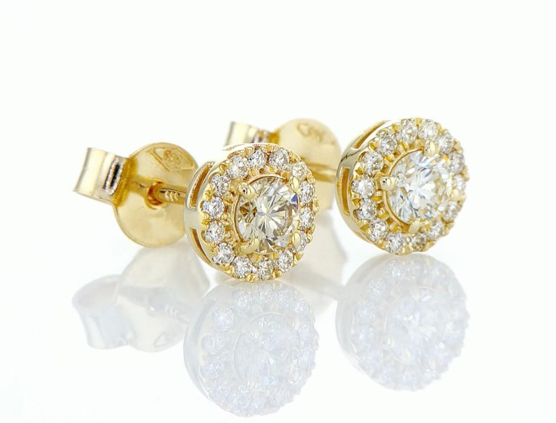 14kt Yellow Gold 0.8ctw Diamond Earrings: One 1.5 gr. 14kt Yellow Gold Diamond Earrings Jewelry Weight: 1.5Grs Total Diamonds Weight: 0.8Cts Main Stones Description: Quantity: 2 Cut and shape: Round Brilliant Carats Weight: 0.6 Clarity: VS2 C