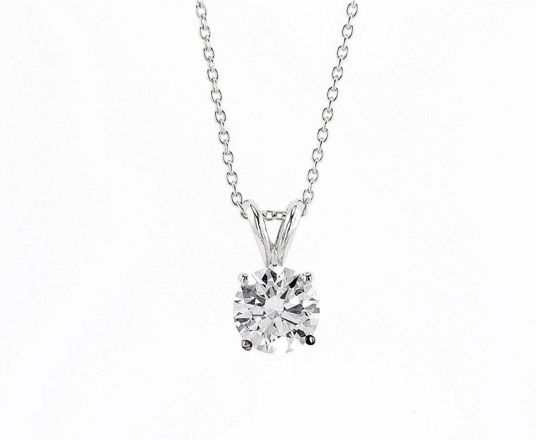 14kt White Gold 1.53ctw Diamond Pendant: One 14k white gold pendant with chain, set with one center lab grown diamond Jewelry Weight: 2.44Grs Total Diamonds Weight: 1.53Cts Main Stones Description: Quantity: 1 Cut and shape: Round Brilliant 