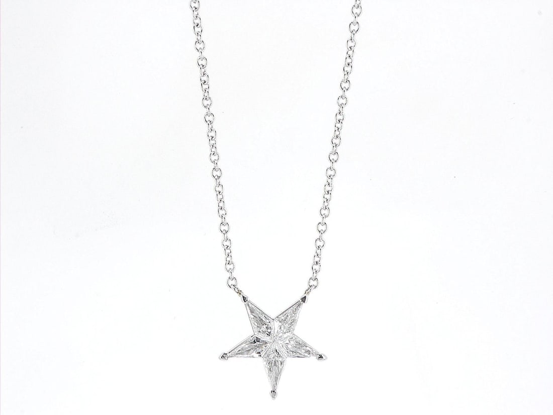 14kt White Gold 0.55ctw Diamond Pendant: One 14k white gold pendant with chain (14k stamped), set with small natural diamonds. Jewelry Weight: 2.46Grs Total Diamonds Weight: 0.55Cts Main Stones Description: Cut and shape: Shield Carats Weigh