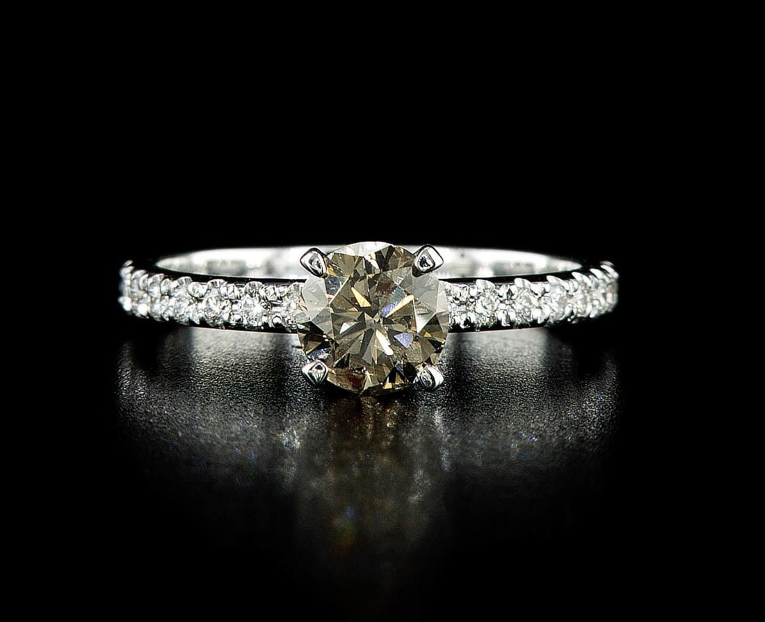 14kt White Gold 1.14ctw Diamond Ring: One 14k white gold ring (14k stamped), set with one center natural diamond and 16 natural diamonds on the sides. Jewelry Weight: 2.36Grs Total Diamonds Weight: 1.14Cts Main Stones Description: Quantit