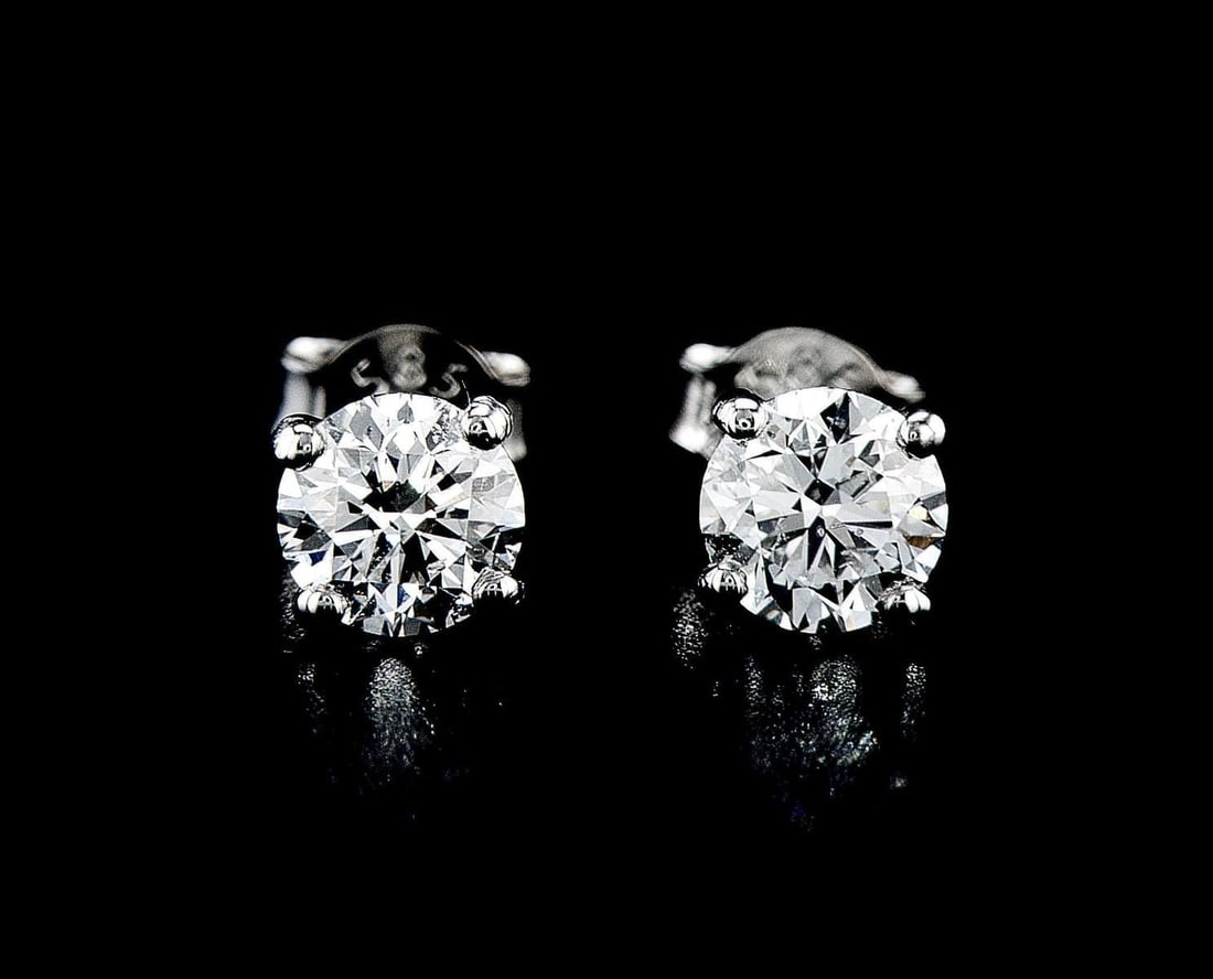 14kt White Gold 1.4ctw Diamond Earrings: One pair of 14k white gold earrings (14k stamped), each set with lab grown. Jewelry Weight: 1.32Grs Total Diamonds Weight: 1.4Cts Main Stones Description: Quantity: 2 Cut and shape: Round Brilliant Ca