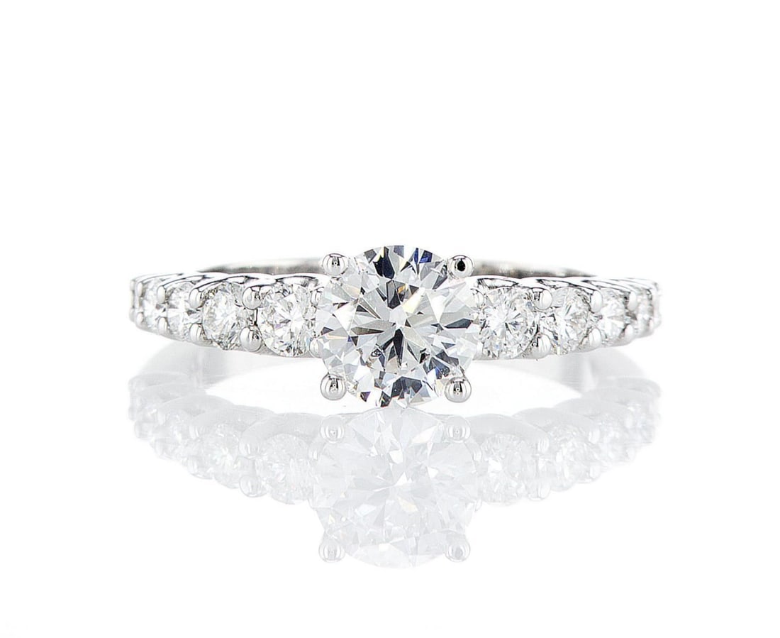 14kt White Gold 1.3ctw Diamond Ring: One 14k white gold ring (14k stamped), set with one center lab grown diamond and small lab grown diamonds on the sides. Jewelry Weight: 3.34Grs Total Diamonds Weight: 1.3Cts Main Stones Description: Q