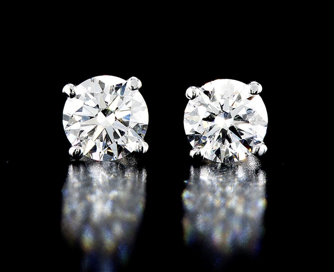 14kt White Gold 3.04ctw Diamond Earrings: One pair of 14k white gold earrings, each set with one lab grown diamond Jewelry Weight: 2.25Grs Total Diamonds Weight: 3.04Cts Main Stones Description: Quantity: 2 Cut and shape: Round Brilliant Cara