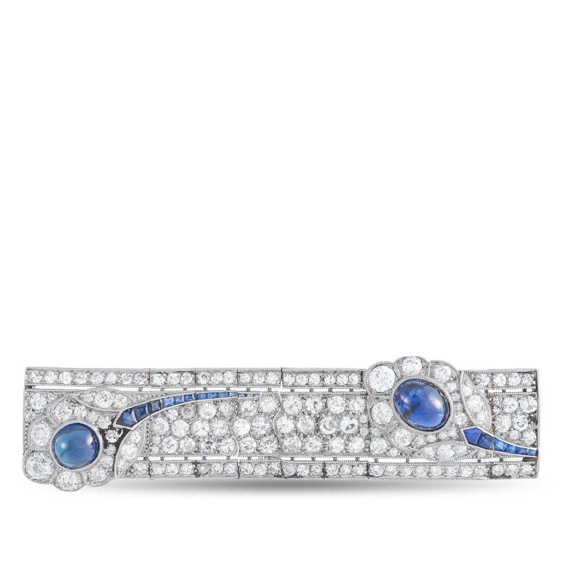 PLATINUM 4.0CT DIAMOND AND SAPPHIRE BROOCH: This brooch is filled with dynamic details. Diamonds with a total weight of 4.0 carats elevate the Platinum setting. Sapphire accents with a total weight of 5.0 carats add a sense of movement to the o