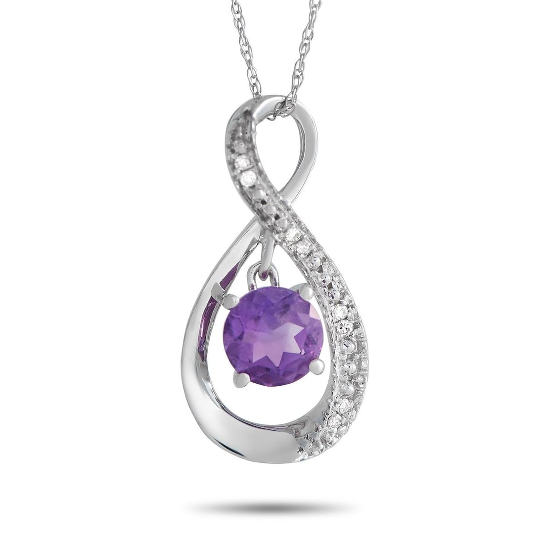 14K WHITE GOLD 0.03CT DIAMOND AND AMETHYST PENDANT NECKLACE: Here is an infinitely stylish necklace making a statement through the lovely shine of diamonds and the lively sparkle of a round amethyst. It features an 18 chain with a spring ring clasp, holding a 0