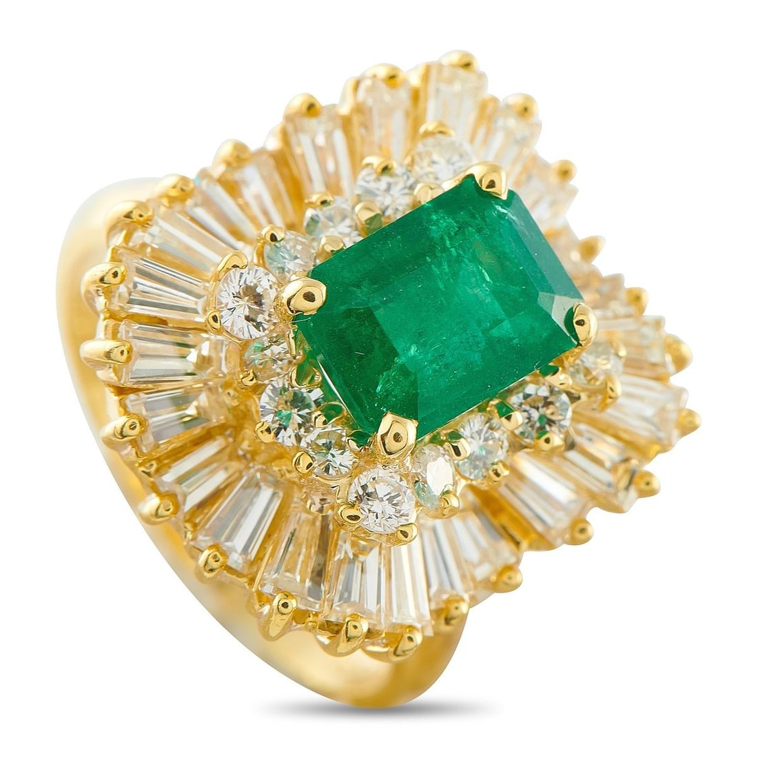 18K YELLOW GOLD 1.75CT DIAMOND AND EMERALD RING: A yellow gold ring that draws directly from its centerstone's inherent geometry. Designed with steps and layers, this yellow gold ring features a split shank with a fine knife edge that rises toward a
