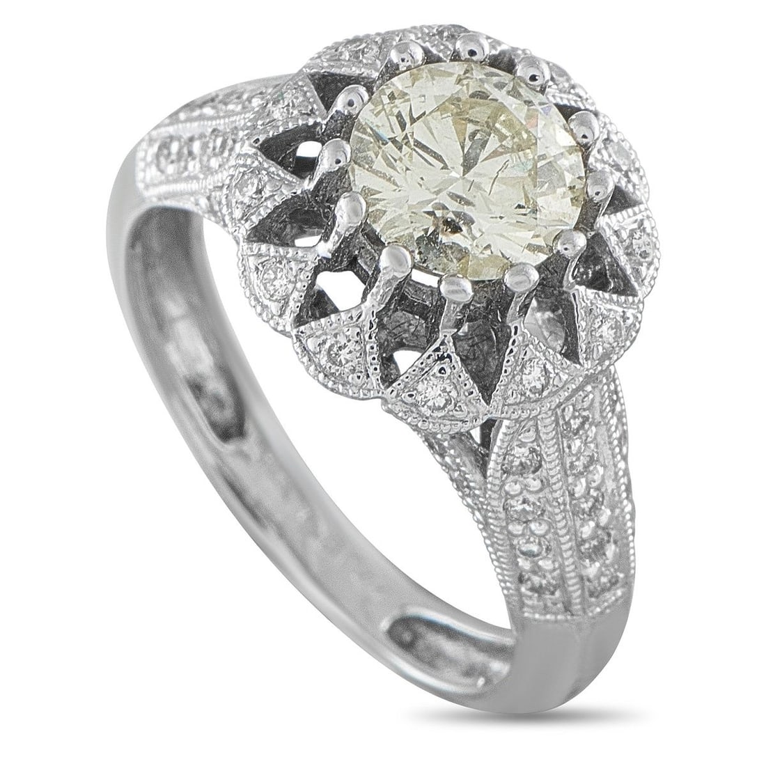 14K WHITE GOLD 1.59CT DIAMOND HALO RING: This vintage-inspired 14K white gold ring features a round brilliant-cut diamond centerstone weighing approximately 1.15ct, encircled by a scalloped, milgrain-edged diamond halo. Pave-set diamonds cas