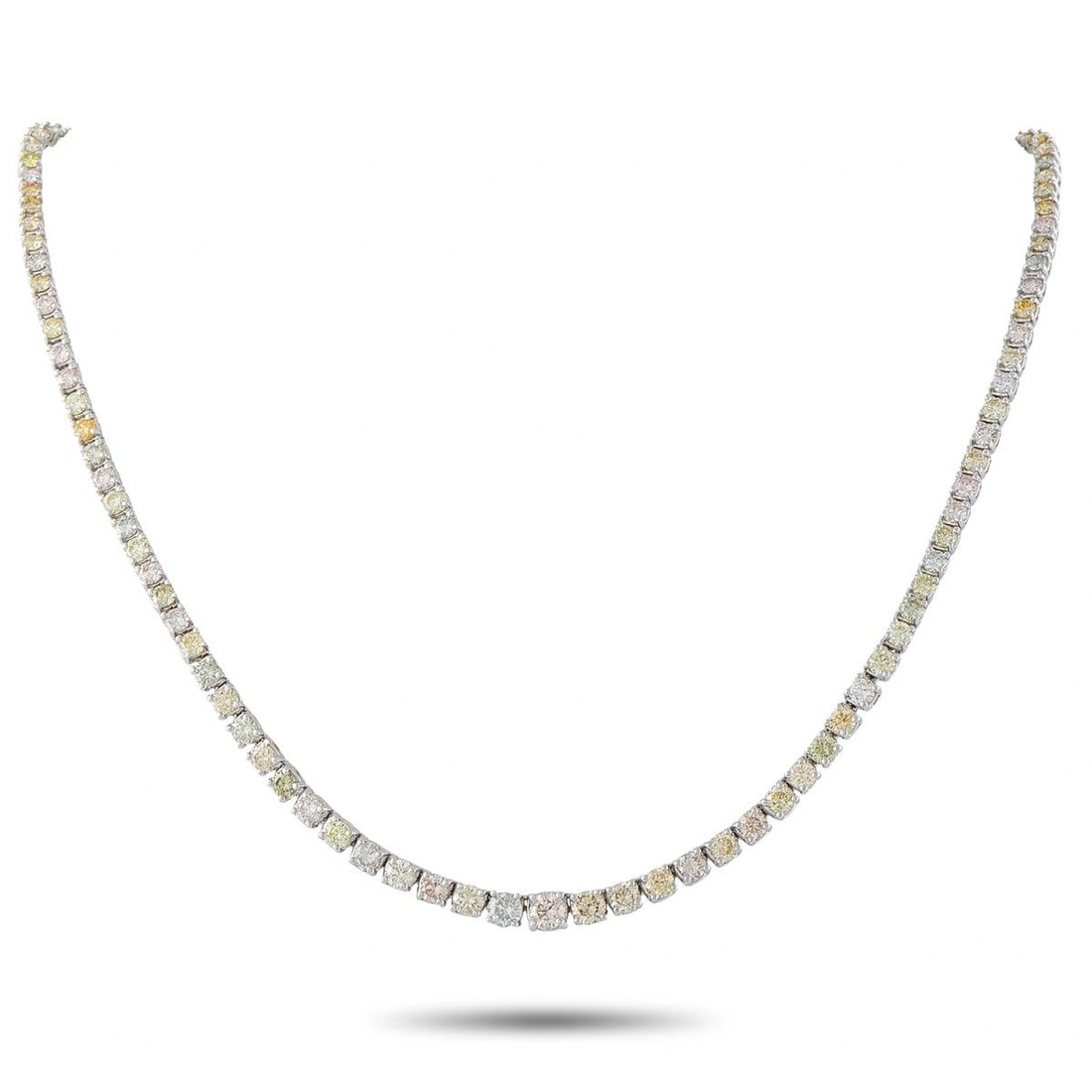 18K WHITE GOLD 11.0CT FANCY COLOR DIAMOND TENNIS NECKLACE: This eye-catching tennis necklace is crafted in 18K white gold and set with 11.00 carats of round brilliant diamonds in natural fancy shades of gray, pinkish brown, and brownish yellow, GIA certified