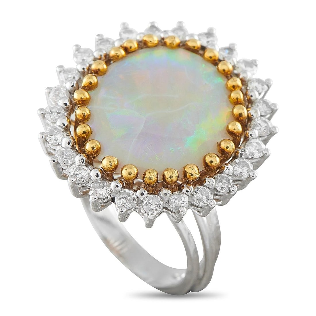 PLATINUM 0.80CT DIAMOND AND OPAL COCKTAIL RING: This cocktail ring features a round cabochon opal weighing approximately 7.33 carats, displaying vivid play-of-color, set within a beaded 18K yellow gold gallery. The opal is surrounded by a halo of r