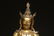 LARGE GILT BRONZE SEATED FIGURE - 11