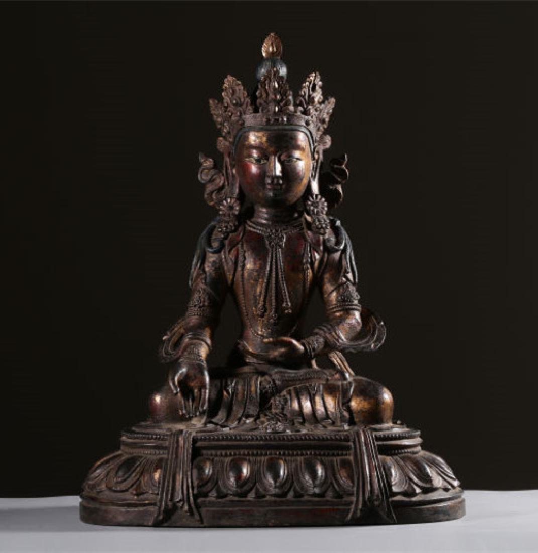CHINESE MING DYNASTY GILT BRONZE BUDDHA: Chinese Tibetan Bronze Buddha.Fine Ming dynasty. Seated in dhyanasana on an elevated double-lotus base with his right hand in bhumisparsha mudra and the left holding a bowl in his lap, clad in a close