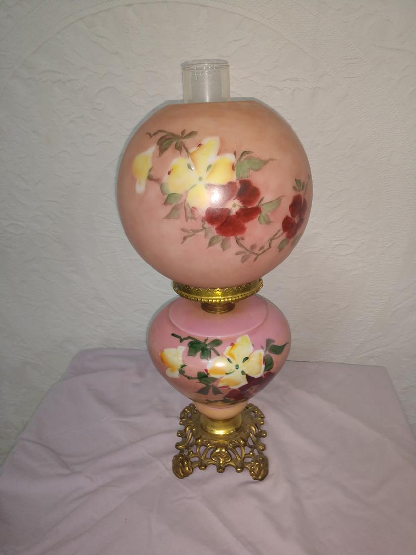 Kerosene Gone With the Wind Lamp: Pink w floral designs. 8"W x 21"H w chimney. New Burner, small chip at base of globe rim. A couple of cracks in brass base.