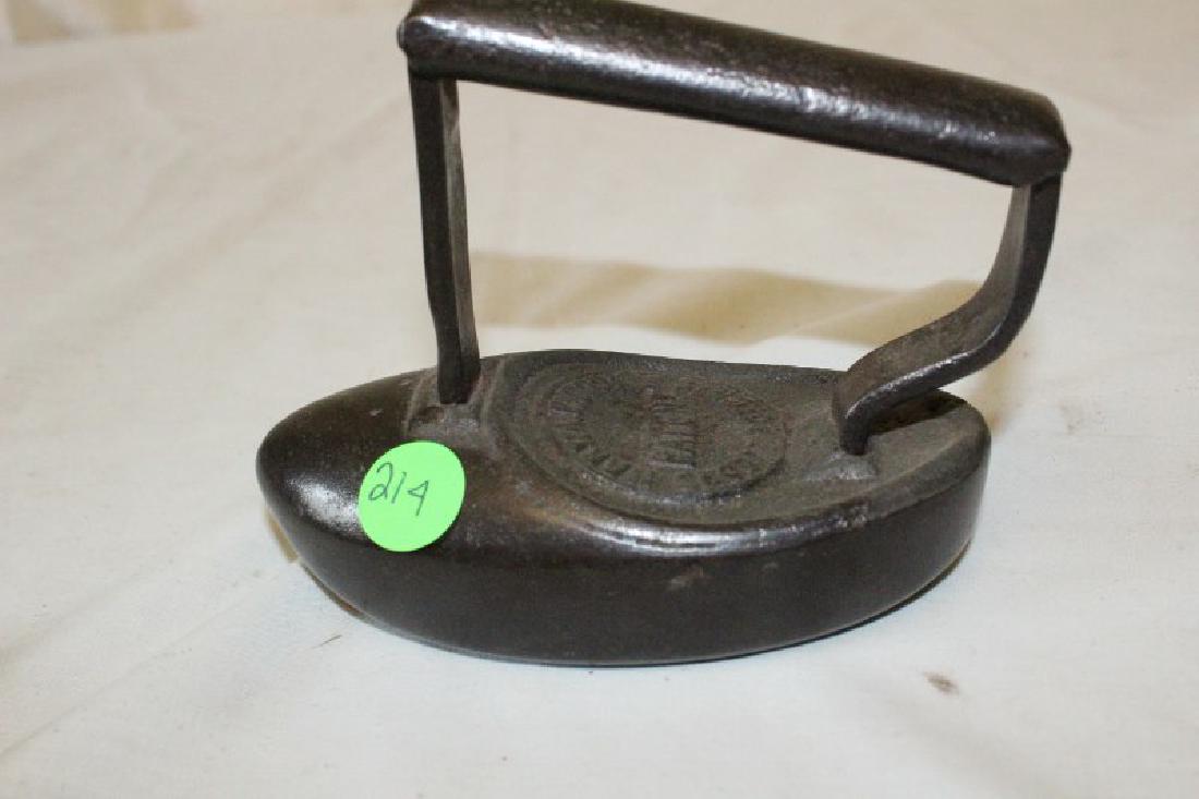 Iron-Polisher: Mary A.B. Cook's Iron-Polisher. Pat'd. 5 1/4" L X 2/3/4" W X 4 1/2" H.